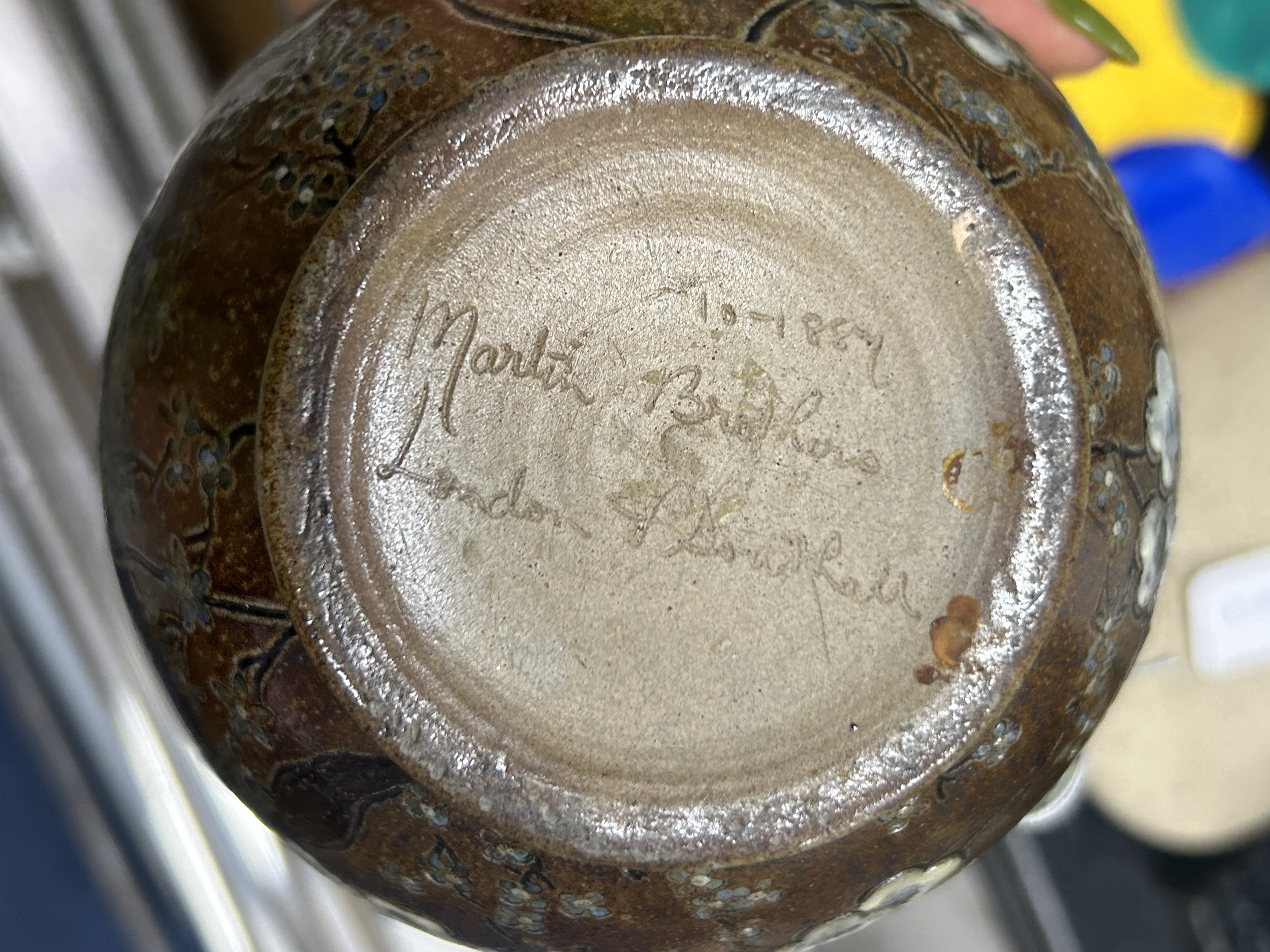 Martin Brothers: A stoneware jug decorated with flowers